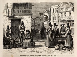 A street in Wales, with locals dressed in traditional costumes, and everyday activities: a first-hand family and women spinning wool with wheels. Engraving to illustrate a voyage in Wales, in 1862, by Alfred Erny, in 
