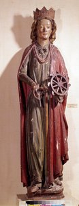 Representation of St. Catherine of Alexandria, holding the wheel instrument of her torment. Polychrome wooden statue by Unknown artist