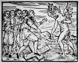 Witchcraft: the devil and the men walking on the Catholic cross - engraving