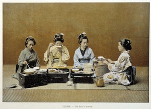 A dining room in Japan: women eating rice with chopsticks and one of them serving tea