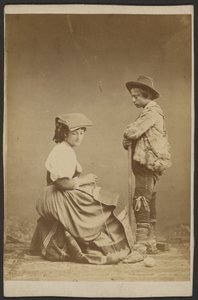 Woman Sewing While Boy Watches
