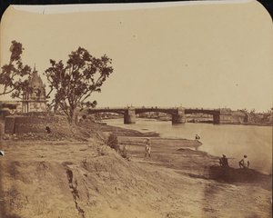 Iron bridge with stone piers, with civilians in the foreground, Gumti River, Lucknow
