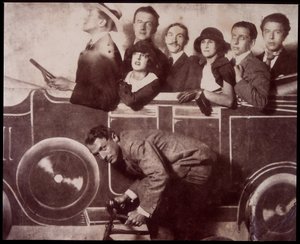 Max Morise, Simone Breton, Paul Eluard, Joseph Delteil, Gala Desnos, Andre Breton, and Max Ernst at the Foire de Montmartre by Unknown photographer