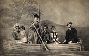 Portrait of a family with a photographer, staged in a boat. Photography, late 19th century, Paris. Coll. Selva by Unknown photographer
