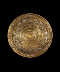 Dish of engraved high-tin bronze inlaid with silver, in the centre a coat of arms, c.1530-1550