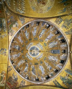 View of the dome with mosaics on a golden background illustrating the Ascension. In the pendants, the four evangelists. Saint Mark and Saint Matthew redone in 1843-1864. The beginning of the 13th century. Basilica San Marco