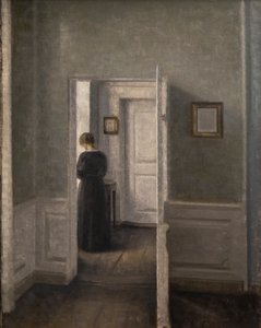 Interior with a Woman Standing by Vilhelm Hammershoi