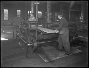 Running Lumber Intended for Use in Casket Manufacture Through a Double-Surface Planer, Oneida, New York, April 3, 1916 by William Davis Hassler
