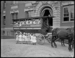 Small Girls Pose in and in Front of a Horse-Drawn Wagon, in Front of an Unidentified Building, Probably the Roman Catholic Orphan Asylum, Kingsbridge, Bronx, c.1910
