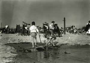 Two Children Play with Wood Scraps in Shallows, Coney Island, c.1910-21 by William Davis Hassler