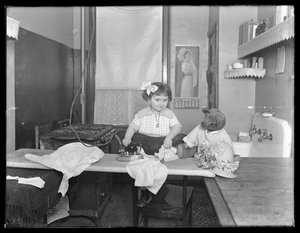 Unidentified Little Girl Demonstrating the Use of an Electric Iron