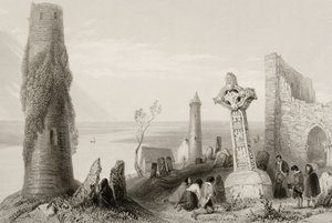 The Ancient Cross and Round Tower at Clonmacnois, County Offaly, Ireland, from 