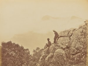 Men Standing on Rock Formations