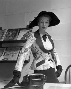 Mannequin wearing a newspaper print jacket