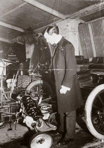 C. S. Rolls Looking at the Engine of a Motor Car in His Garage, c. 1900 by Ferdinand Georg Waldmuller