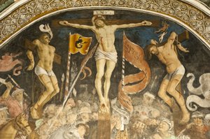 Famous crucifixion group by Hans Clemer, fresco in the choir, parish church of Chiesa Parocchiale, Elva, province of Cuneo, Piedmont, Italy