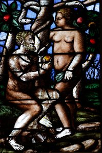 Milan Cathedral. Stained glass window. Adam and Eve. Garden of Eden. Italy by . .