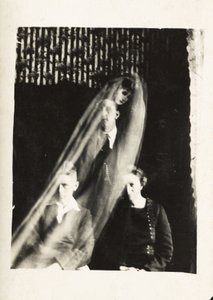 Paranormal Phenomenon: Portrait of a Woman and Two Men, and the Spirit of a Woman Appearing Behind Them