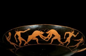 Attic cup with red figures representing athletes in training, a discobole and wrestlers by painter Euergides