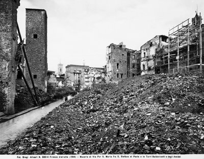 World War II: View of the rubble on Via Por Santa Maria between Santo Stefano al Ponte and the Towers of the Baldovinetti and Amidei in Florence, after the bombing. This photograph was formerly part of the Brogi Collection, but now belongs to the Alinari C by Fratelli Alinari