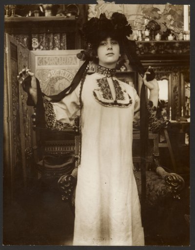 Female Model in a Long White Robe and a Hat with Ribbons, Paris by Alphonse Maria Mucha
