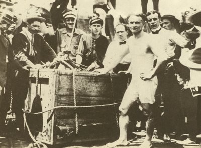 Harry Houdini being lowered into the ice-covered Detroit River in 1907 by American Photographer