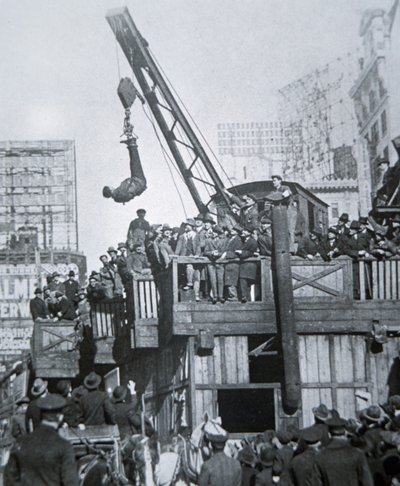 Houdini Escaping from a Strait-Jacket While Suspended from a Crane in New York City by American Photographer
