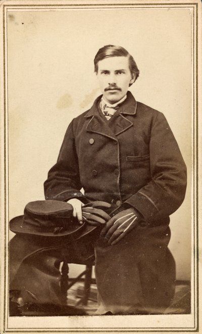Unidentified man in overcoat with hat and gloves by American Photographer