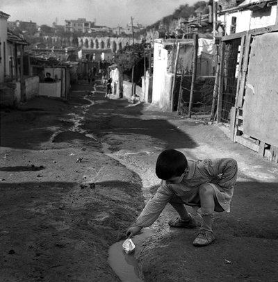 Child Playing with a Small Paper Boat, Borghetto dell