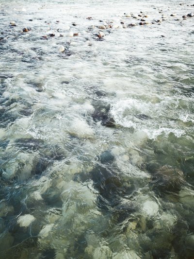 Flowing River Rocks by Angelo Cerantola