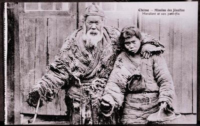 Old beggar with grandson - Early 20th century photograph - Private collection by Anonymous Anonymous