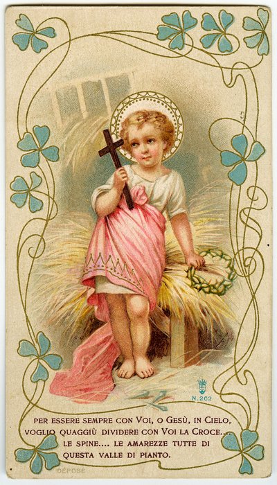 A little boy holding the cross and the crown of thorns, in order to share Jesus