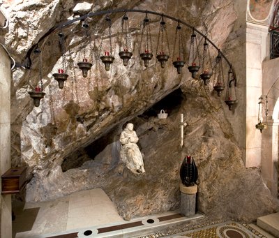 View of the cave of St. Benedetto with statue of the saint by Antonio Raggi. Monastery of Saint Benedetto, Subiaco, Italy by Antonio Raggi