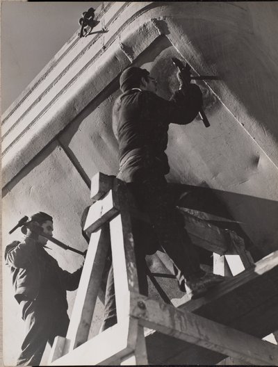Two Men Work on the Underside of a Boat by Arnold Eagle