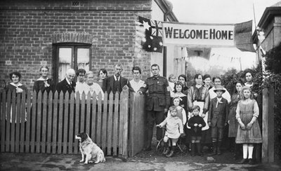 Group portrait of Sapper Arthur Findon Dunbar and his family members gathered outside their house at 45 Chief Street by Australian Photographer
