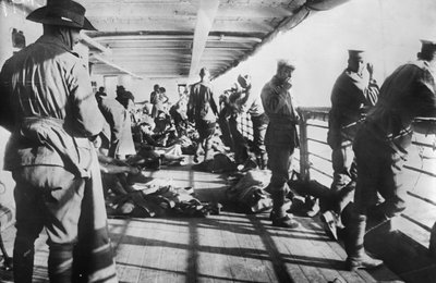 Men of the 3rd Battalion Relaxing on the Deck of the Transport SS Derfflinger Just Before Reveille on the Morning Before the Landing at Anzac Cove, 24 April 1915 by Australian Photographer