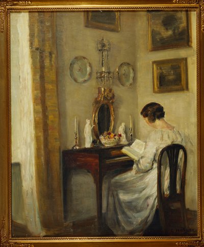 An Interior with a Girl Reading at a Desk by Carl Holsoe