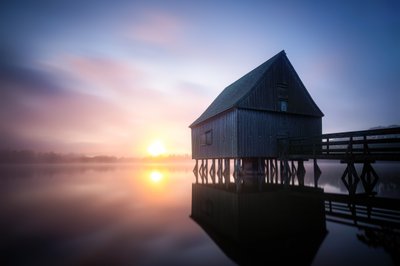 Misty Boathouse Sunrise by Christoph Schaarschmidt