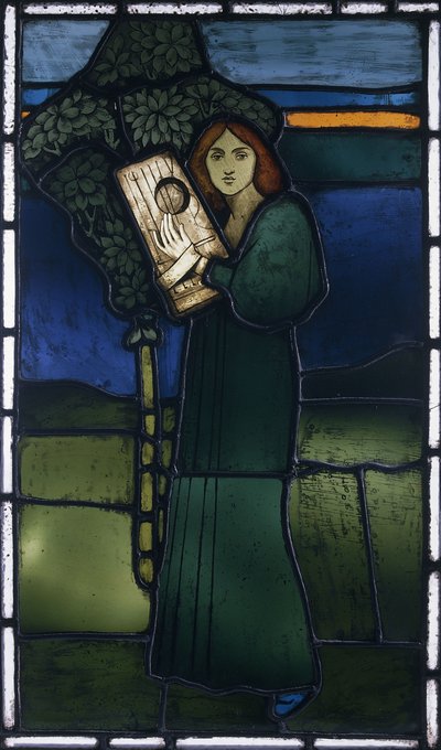 A leaded glass panel depicting a full-length female figure playing a stringed instrument by David Gauld
