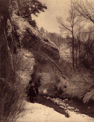 Passing the cliff, winter scene by Edward Sheriff Curtis