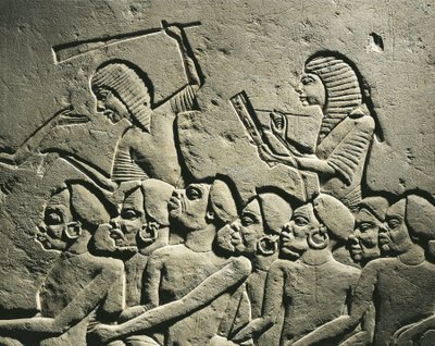 Negroid prisoners surrounded by guards armed with clubs while a scribe draws up a report (detail) by Egyptian 18th Dynasty
