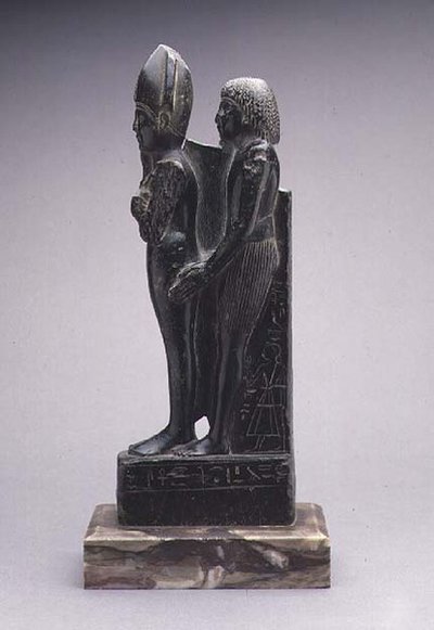 Group of a Man Presenting a Representation of Osiris by Egyptian Egyptian