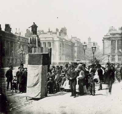 A Crowd Gather to Watch a Puppet Show in London by English Photographer