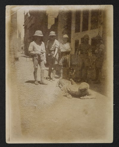 A prisoner under armed guard at Ram Bagh garden, from Views of Amritsar, including the aftermath of the riots by English Photographer