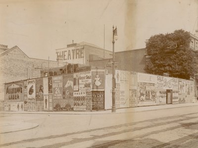 Advertisements on corner of Latchmere Road and Lavender Hill, Wandsworth, London by English Photographer