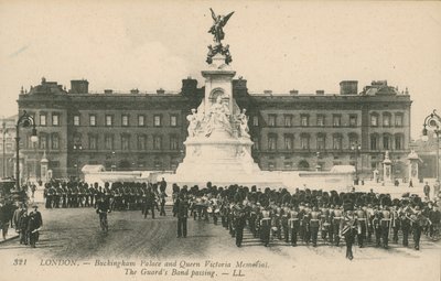 Buckingham Palace and Queen Victoria Memorial; The Guards Band passing by English Photographer