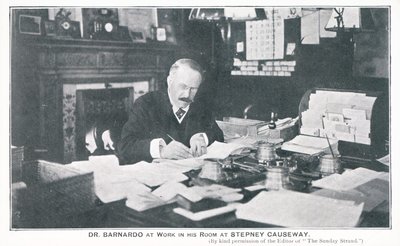 Dr Barnardo at work in his room at Stepney Causeway by English Photographer