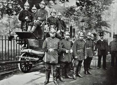 London Fire Brigade: group of firemen, with engine and turncocks by English Photographer