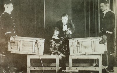 P T Selbit, the British magician, sawing a woman in two by English Photographer
