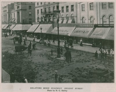 Relaying wood roadway Regent Street by English Photographer